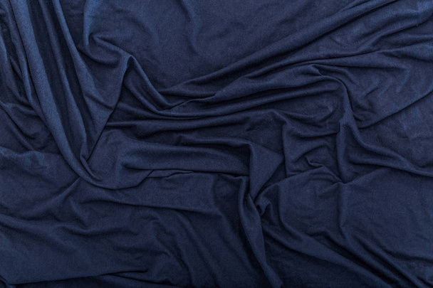 faltig dunkelblaues Tuch Textur Hintergrund - Foto, Bild