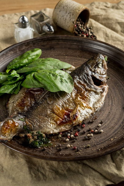 plate with grilled fish and basil - Foto, Bild