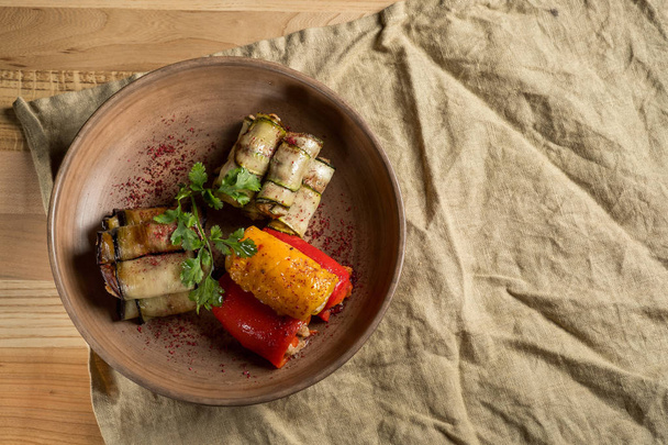 close up view of plate with color grilled stuffed vegetables on rustic background - Valokuva, kuva