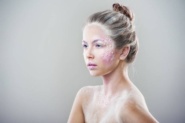 fashion portrait of young beautiful woman with winter fantasy makeup - Fotó, kép