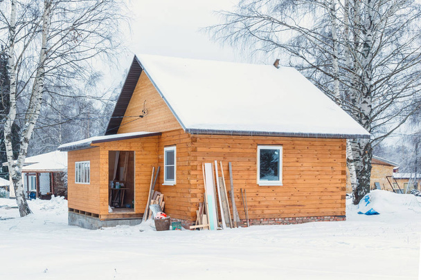 Unfinished wooden house - Фото, изображение