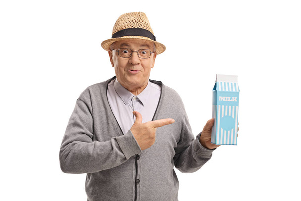 man holding a milk carton and pointing - Foto, afbeelding