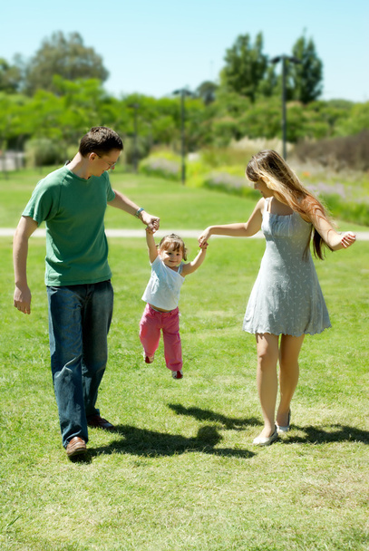 Happy family on walk in park - Фото, зображення