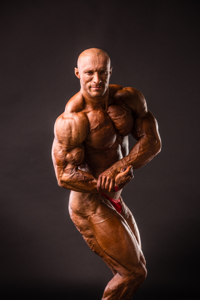 bodybuilder posing in studio - Photo, Image