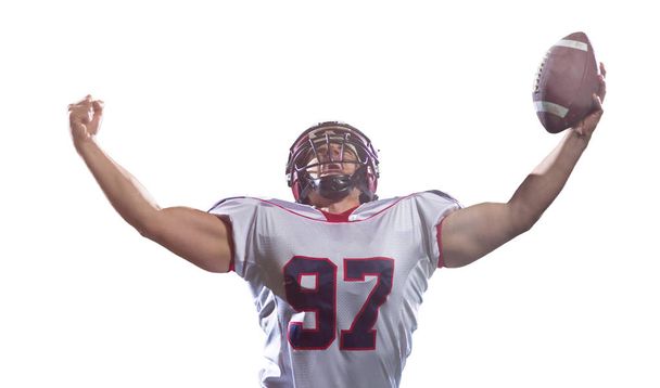 american football player celebrating after scoring a touchdown isolated on white background - Fotó, kép