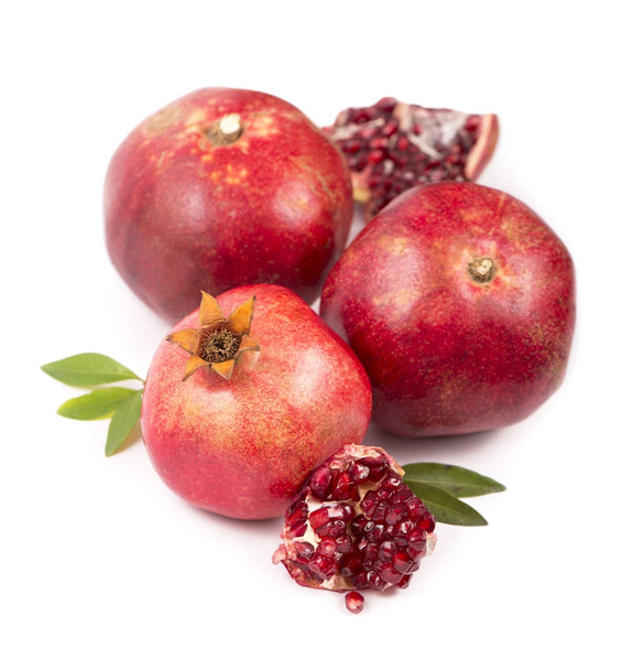 Pomegranate fruit with slice isolated on white background. - Photo, Image