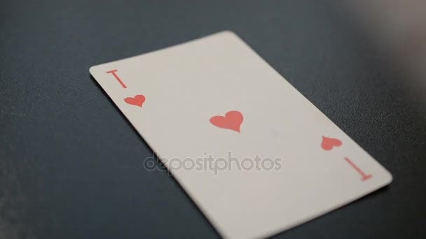 Ace o Hearts on black background hd slow motion footage - Imágenes, Vídeo