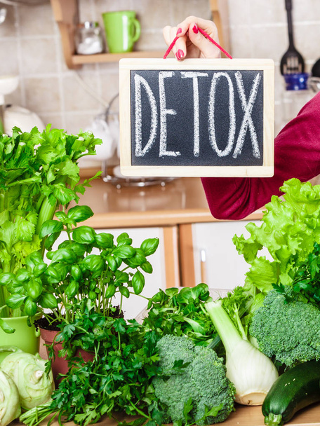 Woman having green diet vegetables, detox sign - Фото, изображение