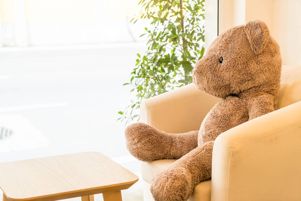 bear doll sit on sofa - Photo, image