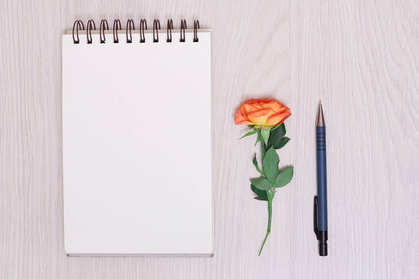 notebook paper, pen and purple dry flowers on white background. white blank notebook and pencil and rose - Fotoğraf, Görsel