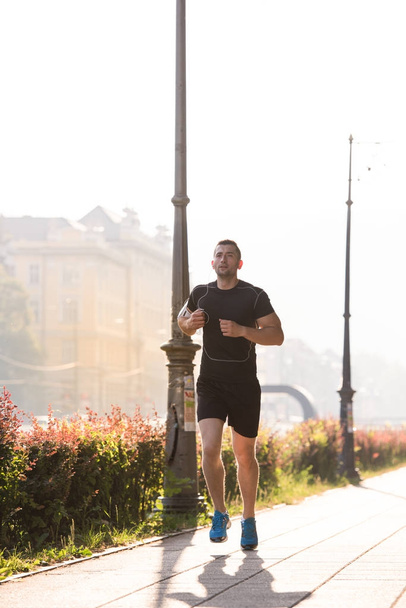 man jogging at sunny morning - Φωτογραφία, εικόνα