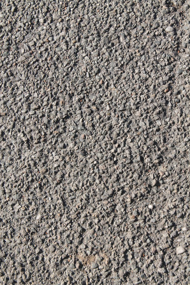 Granite rock closeup background, stone texture, cracked surface - Foto, afbeelding
