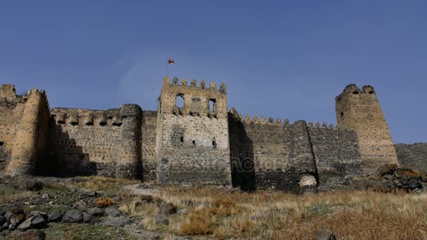 low angle view of the bastion, moat and main outer wall at the front of a large ancient castle - Footage, Video