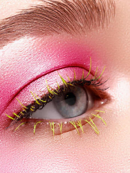Creative Makeup. False long gteen eyelashes closeup. Beauty model woman face make-up with fantasy bright eyelash - Photo, Image