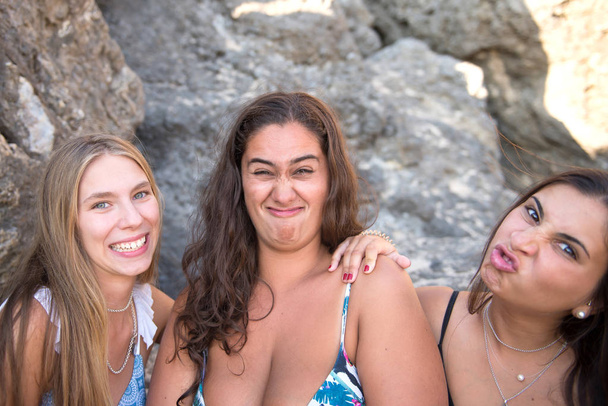 group of beautiful friends posing at the beach - Photo, image