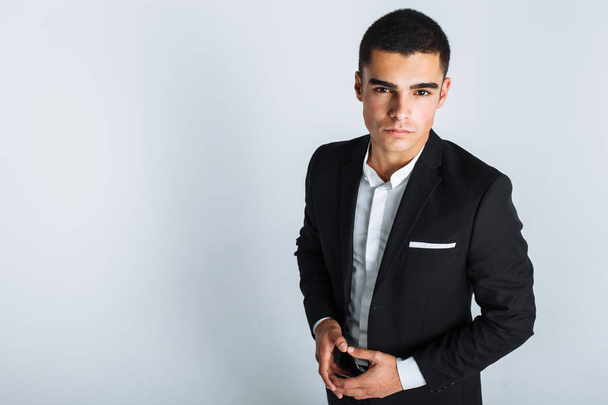 handsome young man in a stylish suit, posing on a white background isolated - Foto, Bild
