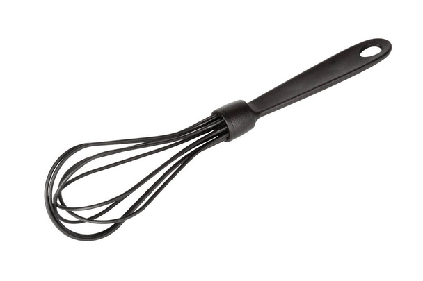 Batteur d'oeufs de fouet de fil de cuisine en plastique noir
.  - Photo, image