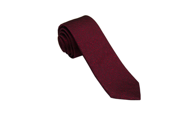 Primer plano de una elegante corbata elegante enrollada y aislada sobre un fondo blanco
 - Foto, Imagen