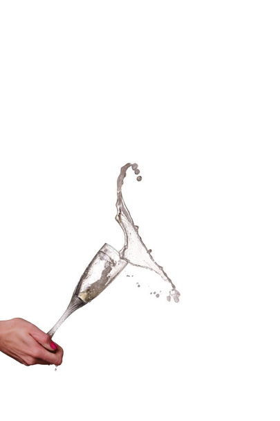 champagne splash from glass with female hand isolated  - Zdjęcie, obraz
