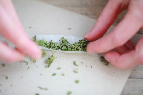 rolled a cigarette with cannabis - Photo, Image