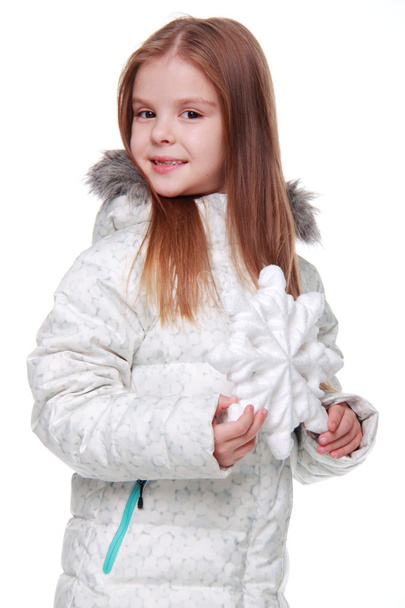 Christmas girl with snowflake in hands - Foto, imagen