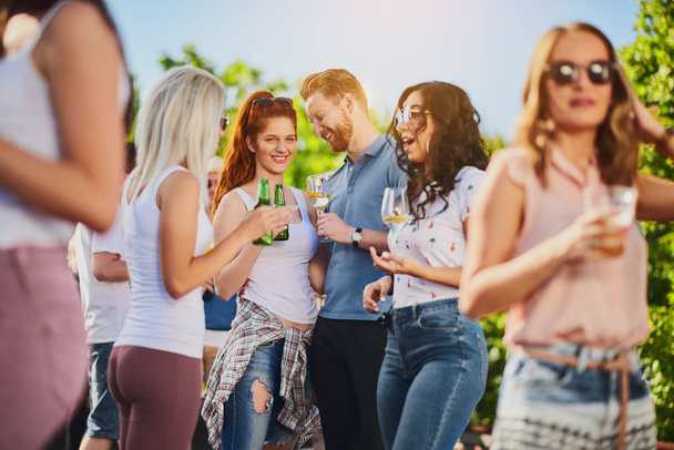 Group of people having a good time at the outdoor party or music festival - Photo, Image