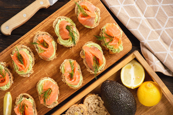 Canape with smoked salmon and guacamole. - Foto, Imagem