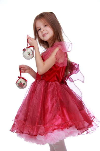 Little girl with a Christmas toy - Fotografie, Obrázek