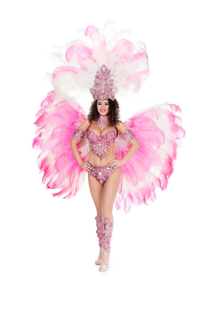 smiling girl posing in carnival costume with pink feathers, isolated on white - Φωτογραφία, εικόνα