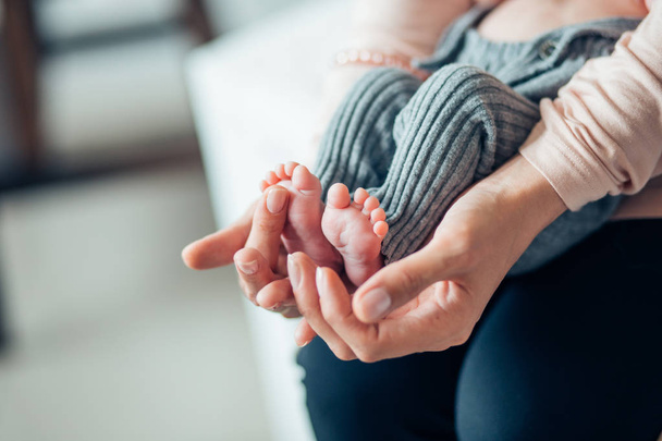 Babys foot in mother hands - Fotó, kép