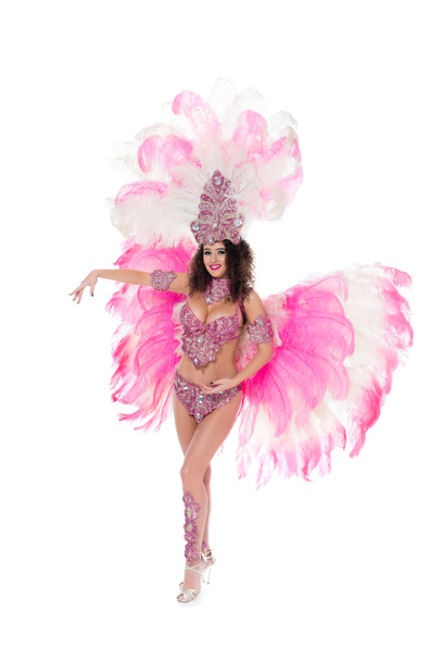 cheerful girl dancing in carnival costume with pink feathers, isolated on white - Φωτογραφία, εικόνα
