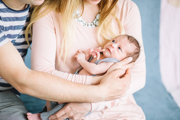 newborn on hands at mum and dad - Photo, image