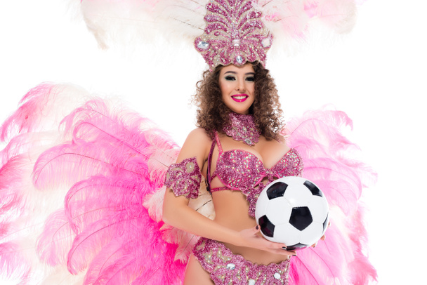 woman in carnival costume holding football ball in hands, isolated on white  - Foto, imagen