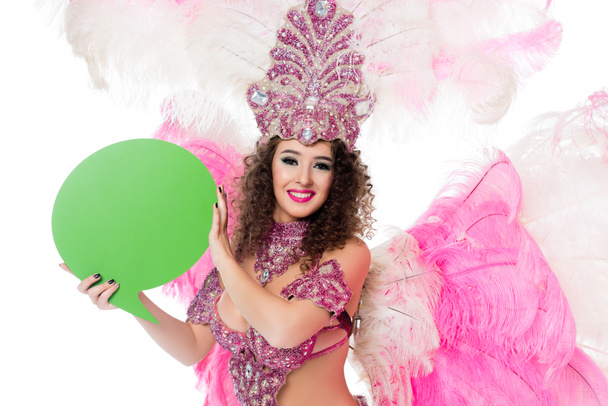 woman in carnival costume holding blank green text balloon, isolated on white - Photo, Image