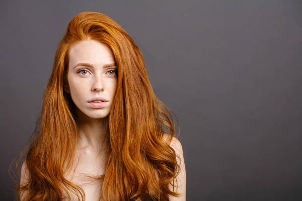 redhead woman,eyelashes, perfect skin. girl,shiny wavy hair - Фото, зображення