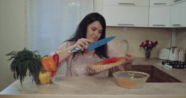 In the kitchen woman are prepare vegetables for dinner - Video