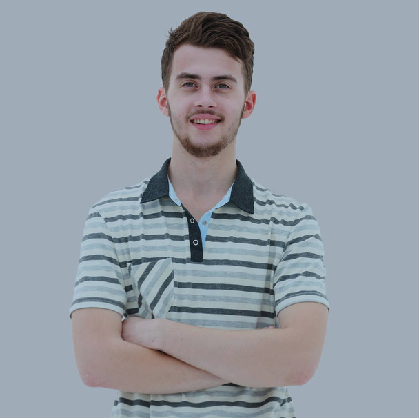 Happy young man is smiling isolated on gray background - Zdjęcie, obraz