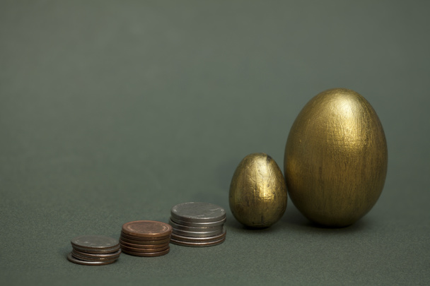  coins pile up and golden eggs - Photo, Image