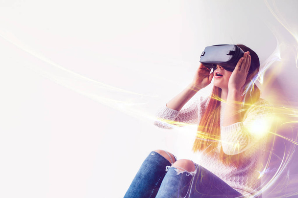 A young beautiful woman in glasses of virtual reality saw something amazing. Modern technologies. - Фото, зображення
