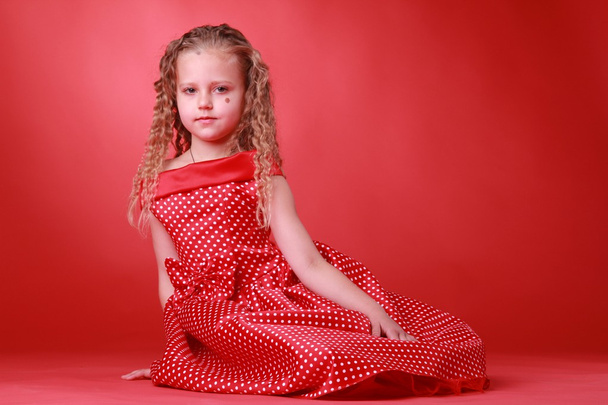 Little cute girl in a polka dot dress - Foto, Bild