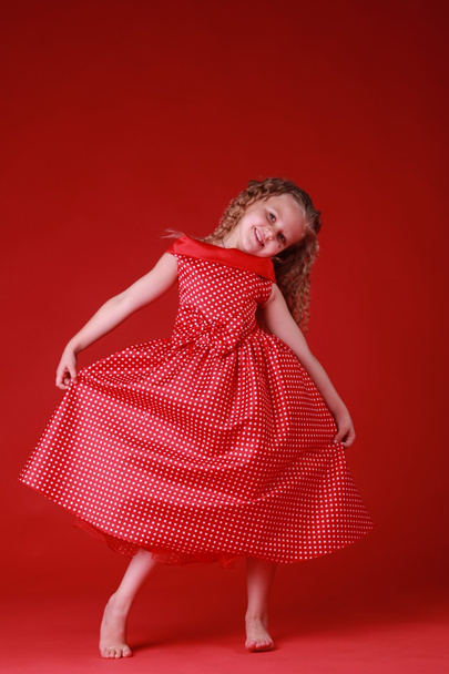 Little cute girl in a polka dot dress - Fotografie, Obrázek