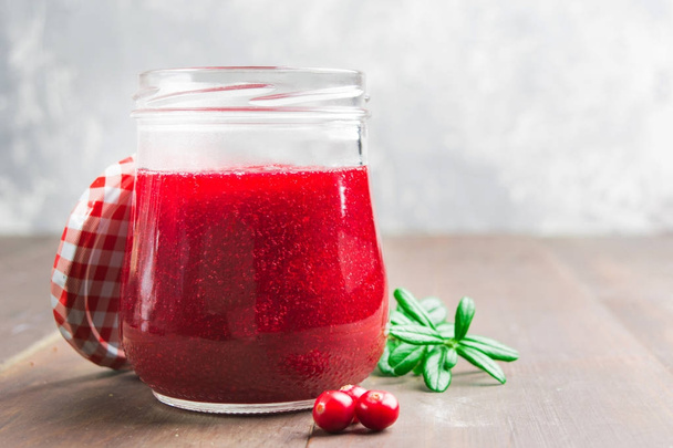 Red berries jam in glass jar - Φωτογραφία, εικόνα