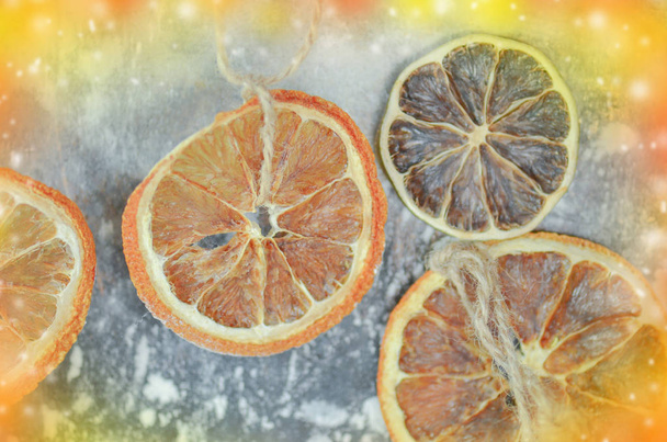 Dried tangerines, oranges, limes on a metal oven - Photo, Image