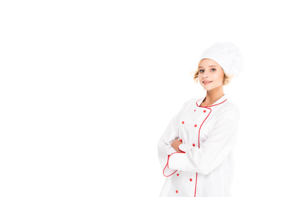 portrait of smiling female chef with arms crossed looking at camera isolated on white - Photo, Image