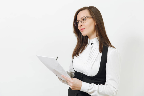 Beautiful serious caucasian young brown-hair business woman in black suit, white shirt, glasses with work paper documents isolated on white background. Manager or worker. Copy space for advertisement. - Foto, afbeelding