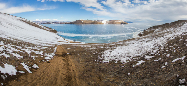 view of sandy shore with ice on water surface,russia, lake baikal  - Photo, Image