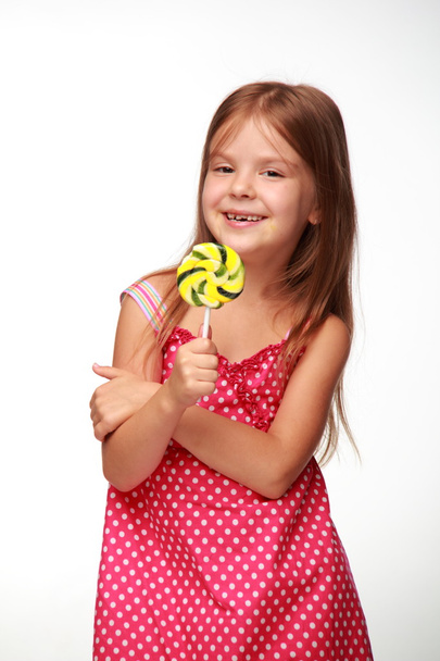 Little girl with lollipop - Foto, Imagen