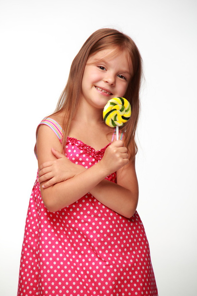 Little girl with lollipop - Fotó, kép