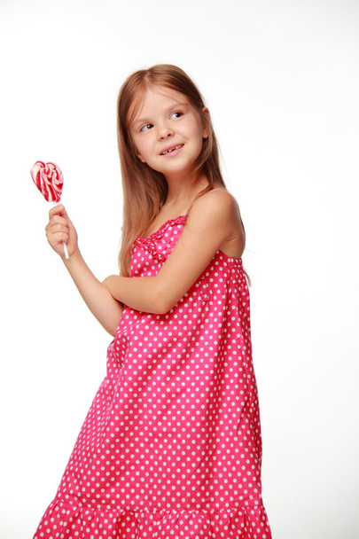 Little girl with lollipop - Fotó, kép