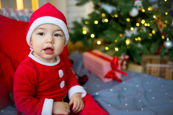 Baby in a christmas hat - Фото, изображение